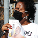 Sharon Lavigne of RISE St. James speaks at a protest at the Army Corps of Engineers office in New Orleans. Sharon is holding a photograph of a fellow advocate, Keith Hunter, who died of a sudden respiratory illness.
